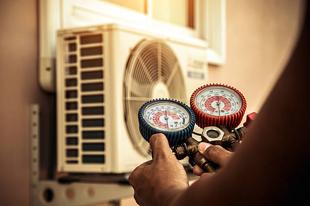 Professional Air Conditioning Service technician working in Saint Peters, MO